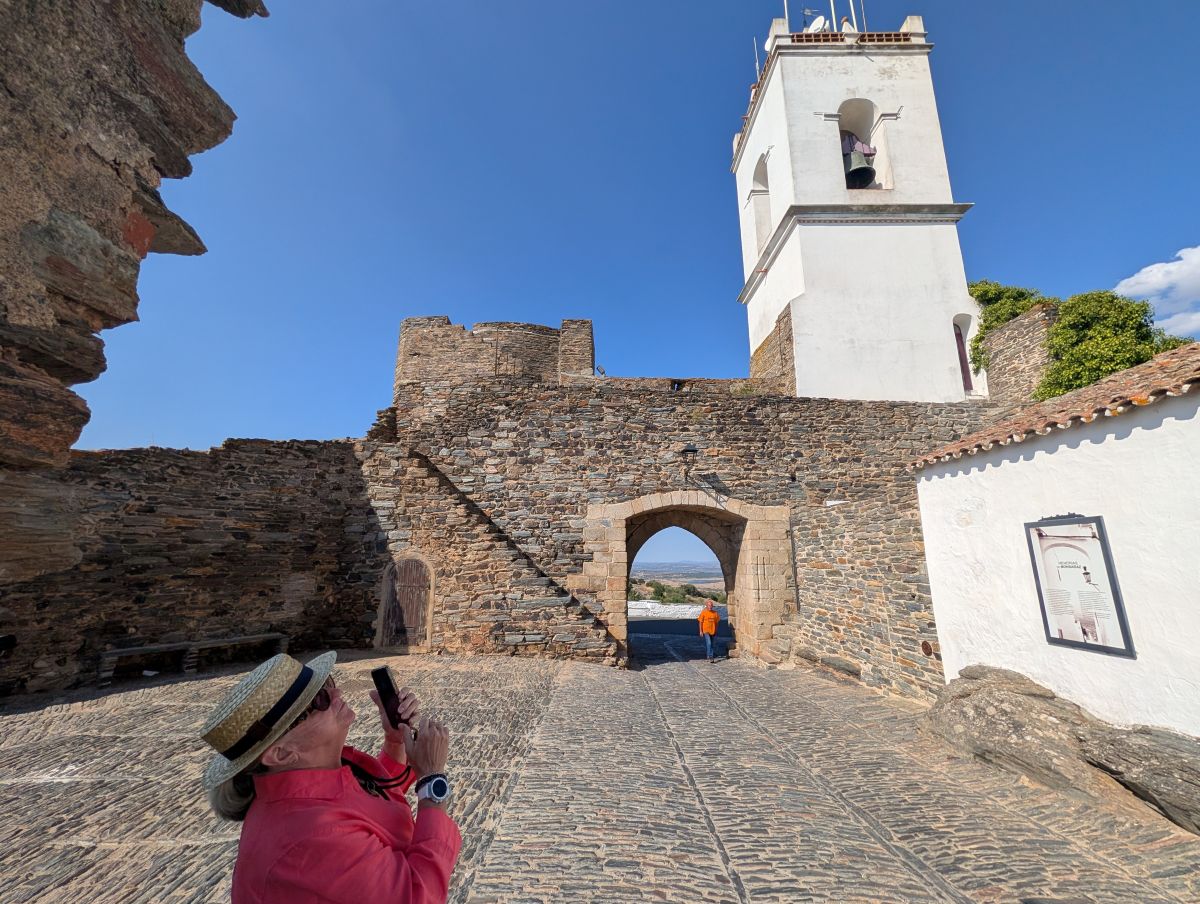 Inside the walls of Monsaraz — castle gate and bell tower