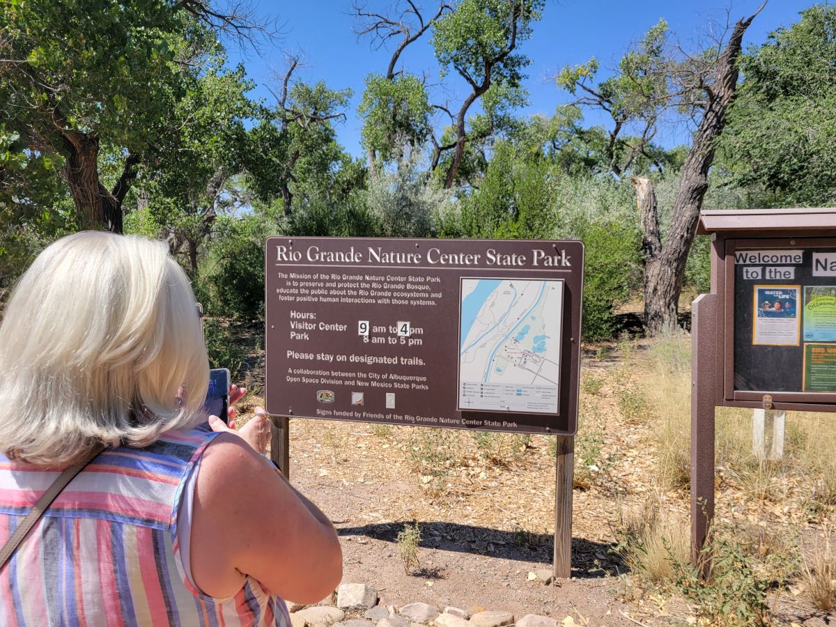 Shirley reading the sign at Rio Grande Nature Center State Park, Albuquerque