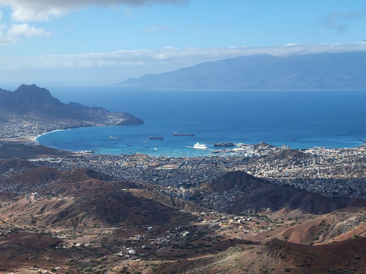 Aerial view of Mindelo and its harbor from the hills of São Vicente, the cruise ship clearly visible in the blue bay