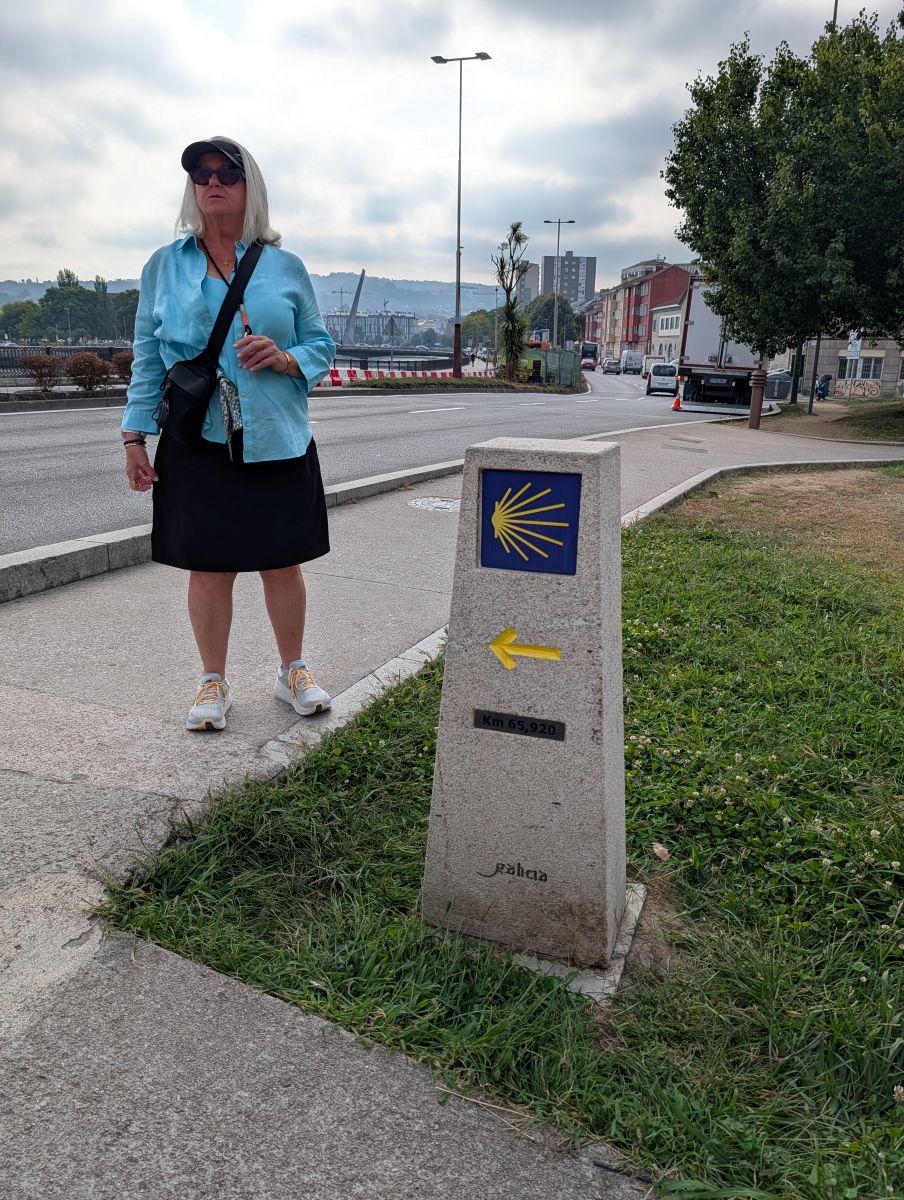 Shirley at a Camino de Santiago waymarker in Pontevedra