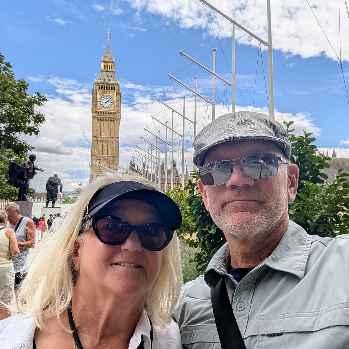Shirley and Keith selfie with Big Ben rising above Parliament Square behind them, Churchill's statue visible to the left