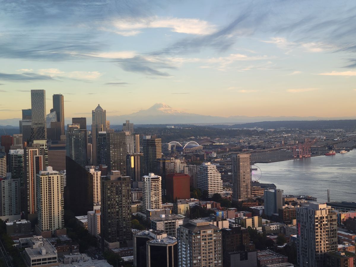 Seattle city skyline at golden hour with Mount Rainier visible in the background