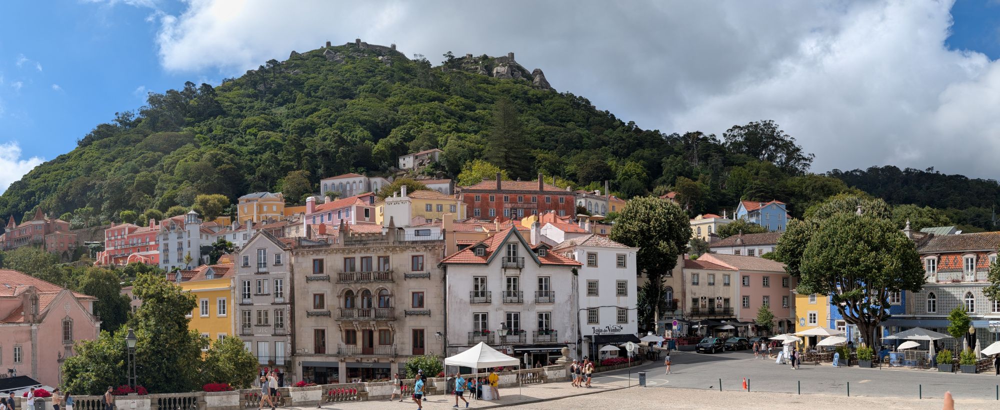 Sintra village square with the Castelo dos Mouros on the hill above